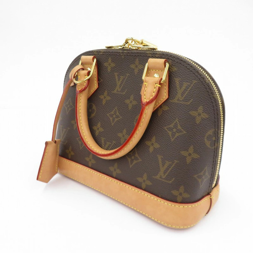 LOUIS VUITTON Monogram Alma Handbag Brown
